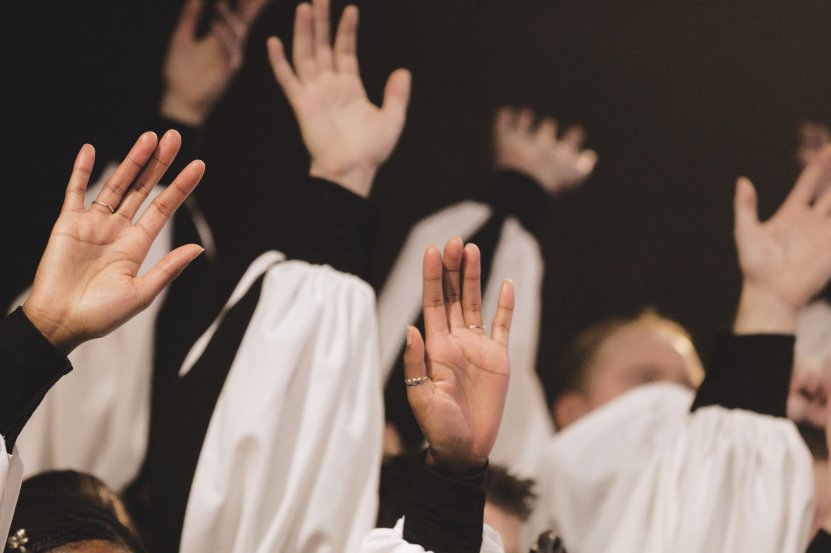 Church Choir's Hands Raised