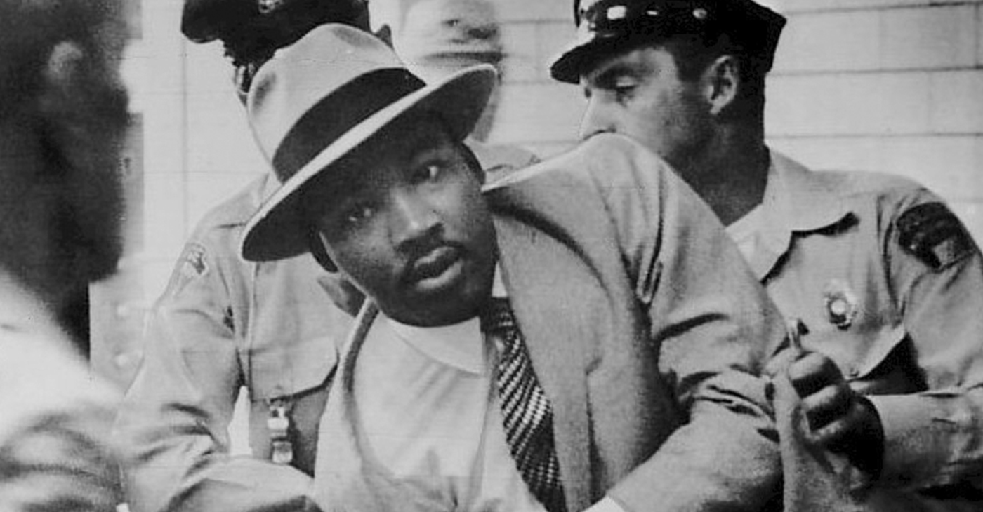 Dr. Martin Luther King, Jr. being arrested in Montgomery, Alabama, for 