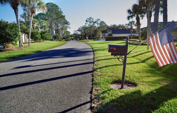 A suburban street with US flags in Florida, USA