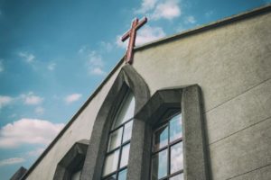 Church with cross on Roof (unsplash)