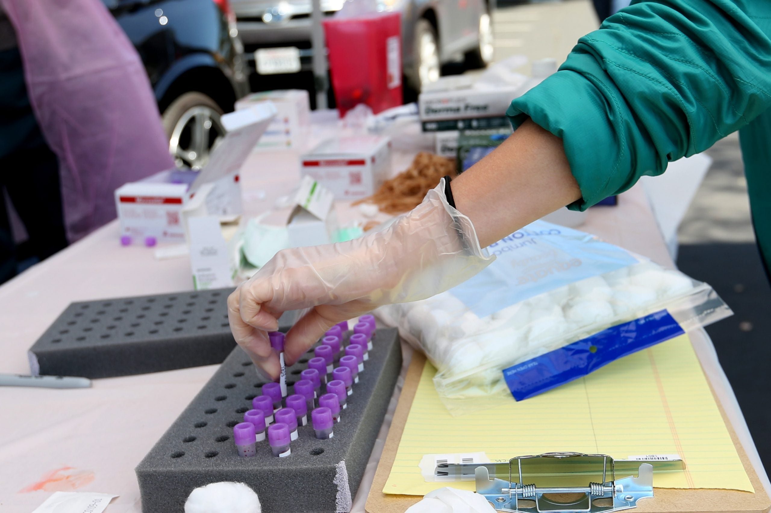 Stanford medical students place blood samples in holder in Mountain View, California near Santa Clara