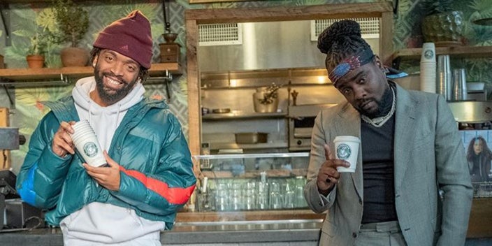 Kerby Jean-Raymond and Wale pose in front of Morebucks Coffee for the latter's 