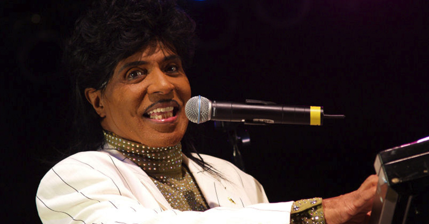 Little Richard’s high-energy performances while playing the piano included dancing on top of the piano, running on and off the stage and throwing souvenirs to the audience. He also dressed flamboyantly onstage. Some of what is taken for granted now in popular music was invented by Little Richard. (Photo: Little Richard performing at the University of Texas Forty Acres Festival in 2007. Wikimedia Commons / Anna Bleker)