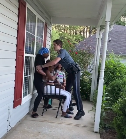 Former Officer Oxford places hands on Black woman 