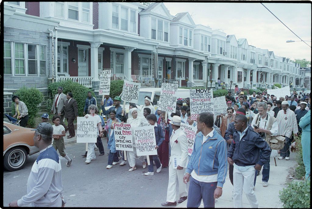 MOVE Protesters Holding Placards