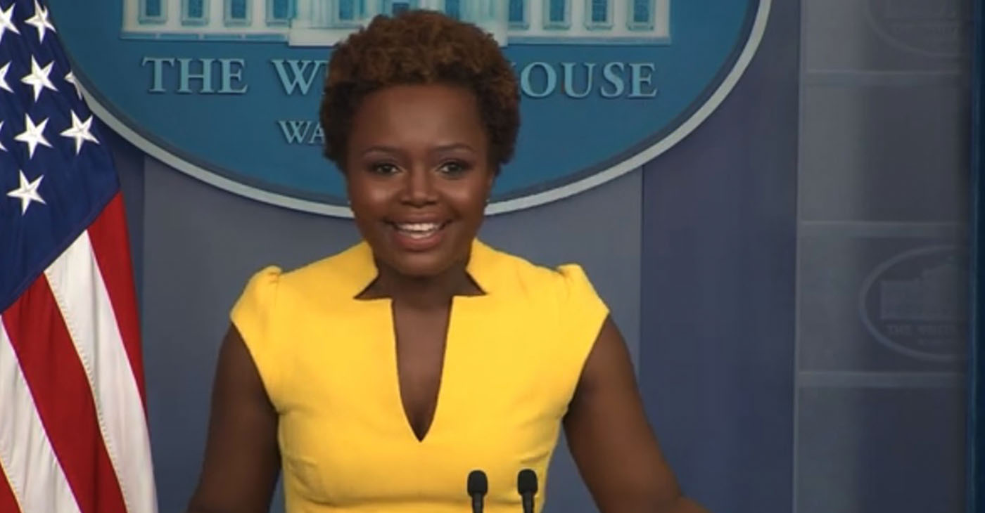 Principal Deputy Press Secretary Karine Jean-Pierre conducts press briefing at the Biden White House, becoming first openly gay spokeswoman and second Black woman ever to hold the role. Screencap at 0:11.