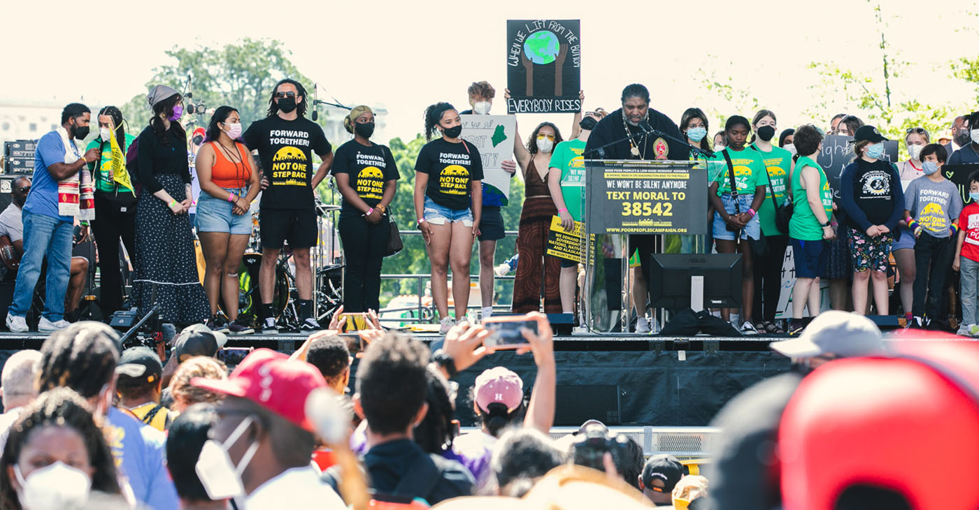 Rev. Dr. William J. Barber, II (standing behind podium) is continuing the efforts of the Poor People’s Campaign Dr. King began. (Photo: Mark Mahoney / Dream In Color Photography)