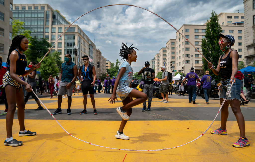 WASHINGTON,DC-JUNE27: Taylor Blackwell, 9, jumps double dutch r