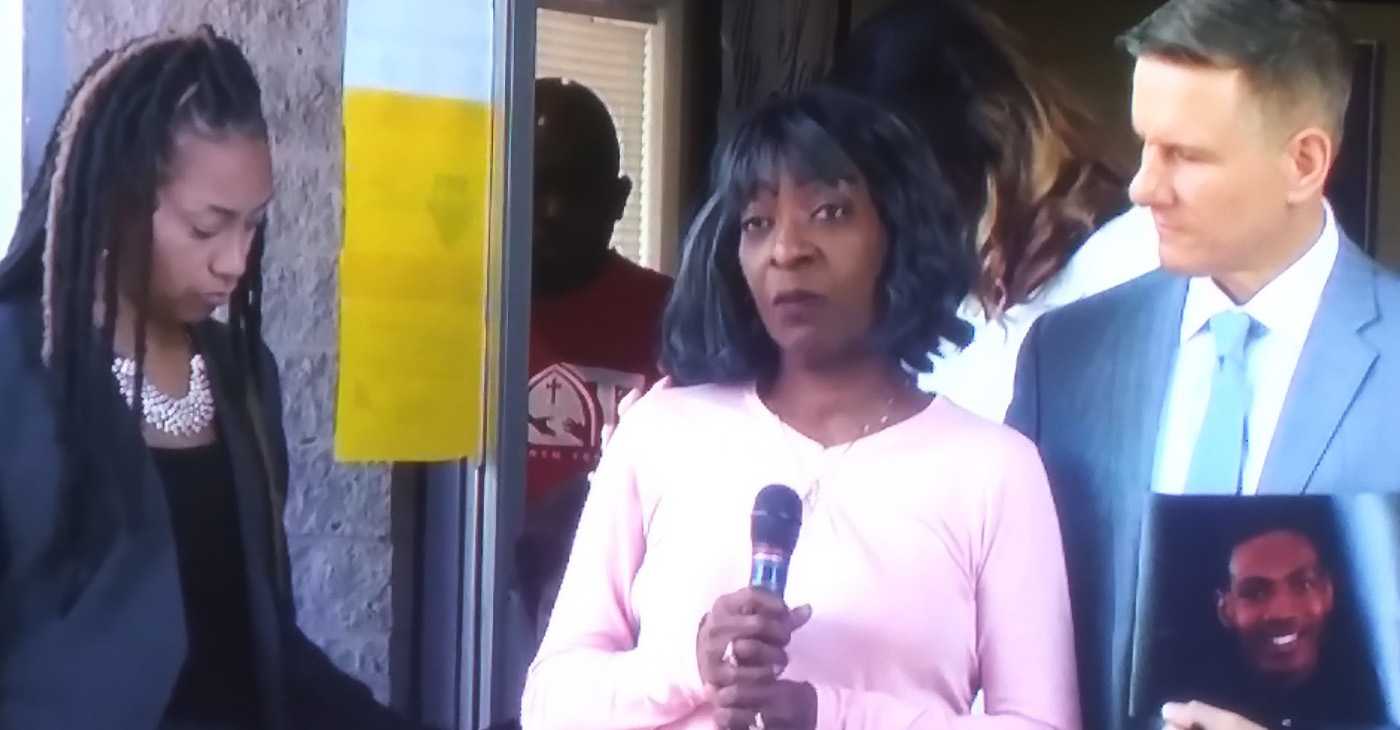 Lajana Walker-Dawkins, Jaylamd Walker’s Aunt and family spokesperson, pleads for” Peace” from protestor seeking justice as Atty Bobby DiCello looks on.