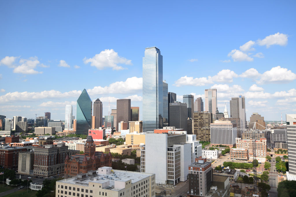 Skyline of downtown Dallas, TX on a partly cloudy day