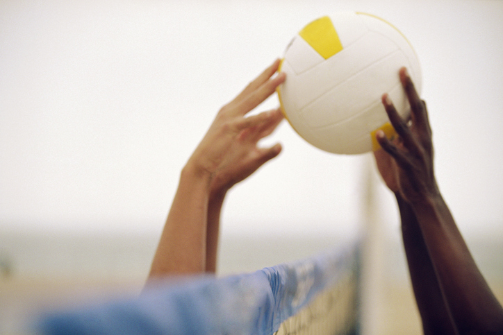 Hands Hitting Volleyball