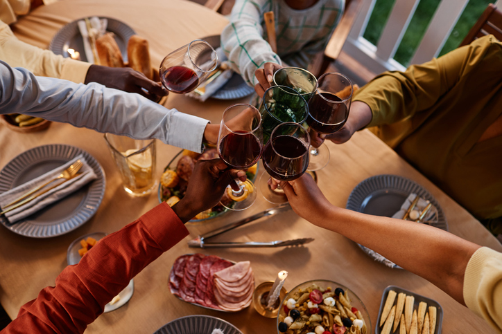 Family Toasting at Dinner Party Top View