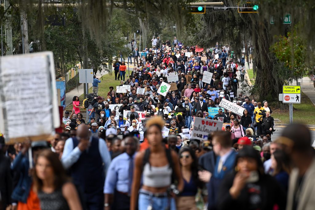 Demonstrators protest Florida Governor Ron DeSantis