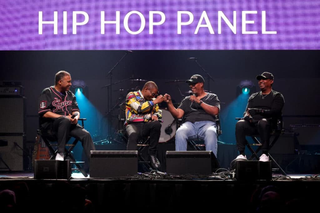 (L-R) L. Londell McMillan, Doug E. Fresh, Tony M., andChuck D speak onstage at Celebration 2023 (Photo Credit: Kevin Mazur for Getty)