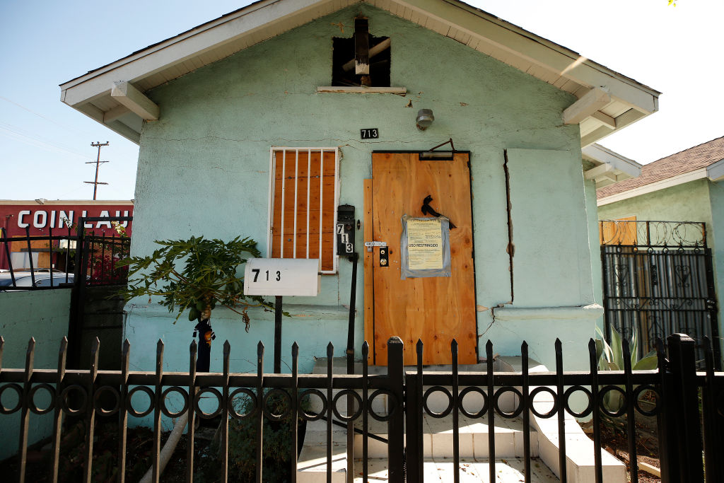 Damage to homes and property around the neighborhood on the block of East 27th Street between Stanford Avenue and San Pedro Street that was damaged by the LAPD's fireworks explosion before the 4th of July.