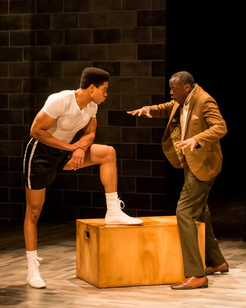 From L to R: Ray Fisher and Edwin Lee Gibson in “Fetch Clay, Make Man” at Center Theatre Group's Kirk Douglas Theatre June 18 through July 16, 2023, produced in association with The SpringHill Company. Photo credit: Craig Schwartz Photography