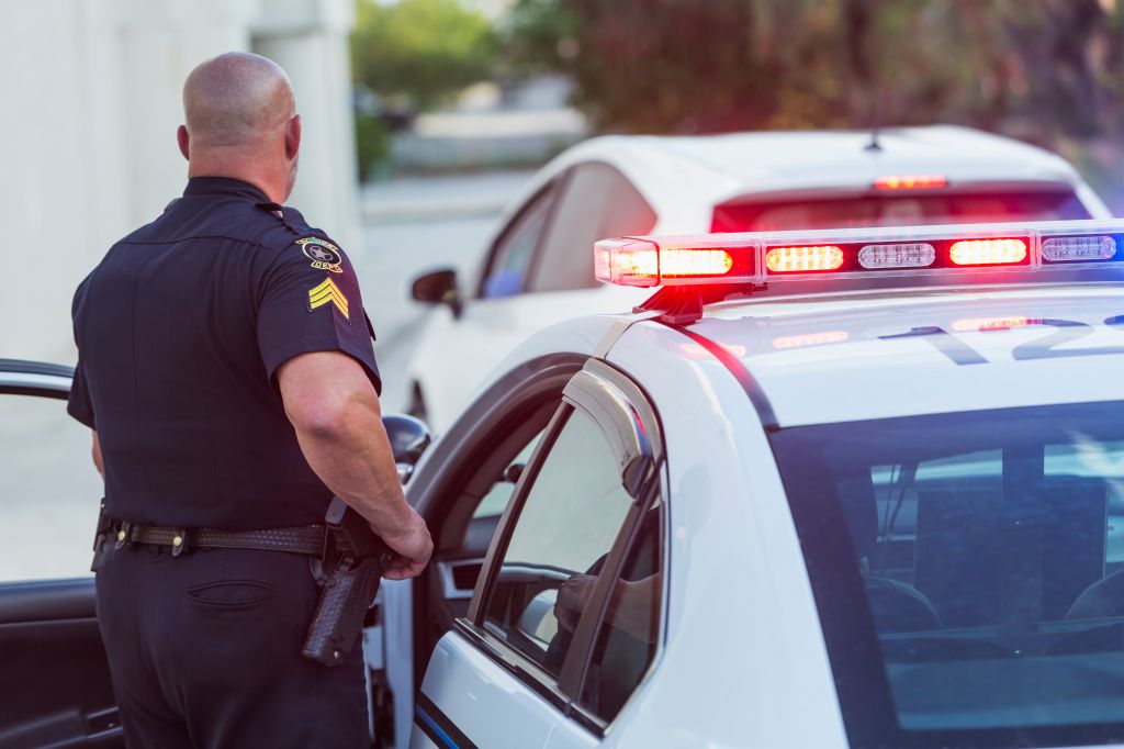 Policeman pulls over a driver