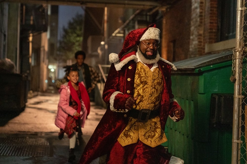 (L-R): Madison Skye Validum as Charlotte, Chris 'Ludacris' Bridges as Eddie, and Lil Rel Howery as Nick in DASHING THROUGH THE SNOW, exclusively on Disney+. Photo by Steve Dietl. © 2023 Disney Enterprises, Inc. All Rights Reserved.