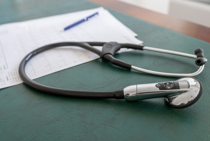 Medical instruments. Medical stethoscope on the table in the doctor’s office