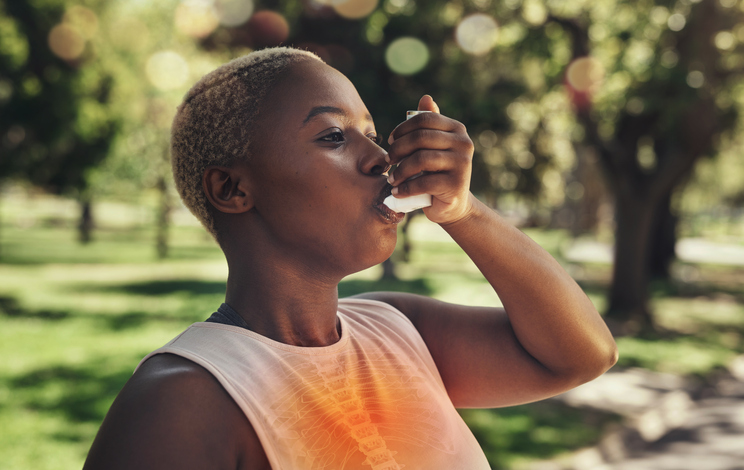 Nature, fitness and woman with asthma pump after an intense running workout or training in park. Healthcare, sports inhaler and African female with respiratory problem after cardio exercise in field.