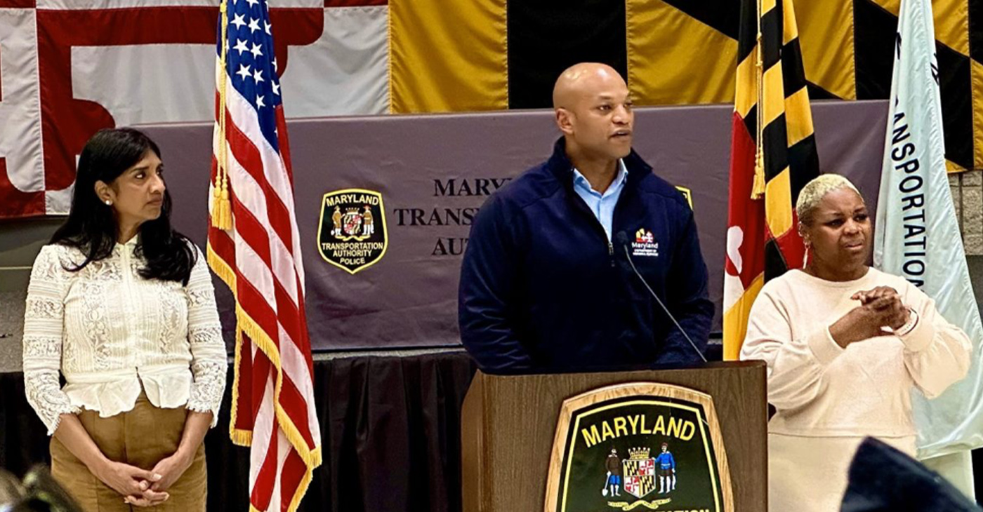 Maryland Governor Wes Moore gives updates on the collapse of the Francis Scott Key Bridge in Baltimore on April 1 and efforts to recover from the disaster with Lt. Gov. Aruna Miller (left) and April Jackson-Woodard, a freelance sign language interpreter, at his side. (AFRO Photo / Alexis Taylor)