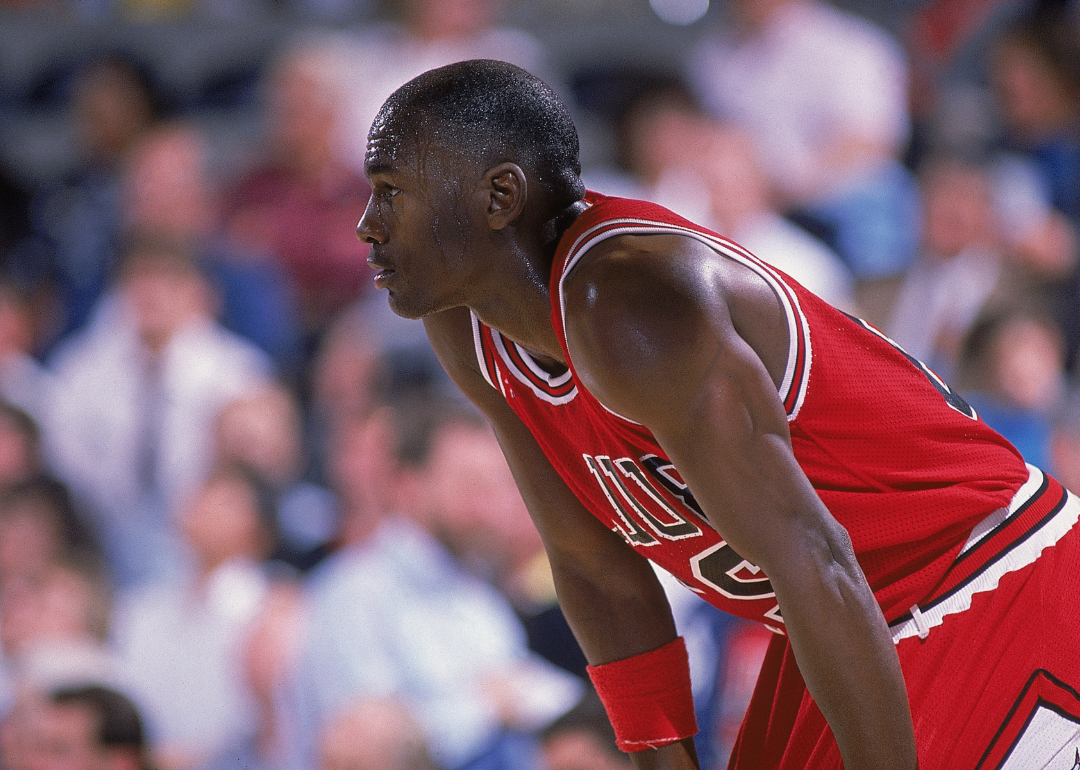 Definitely one of America's 10 Black Billionaires: Michael Jordan, #23 of the Chicago Bulls, resting on the court during a game.