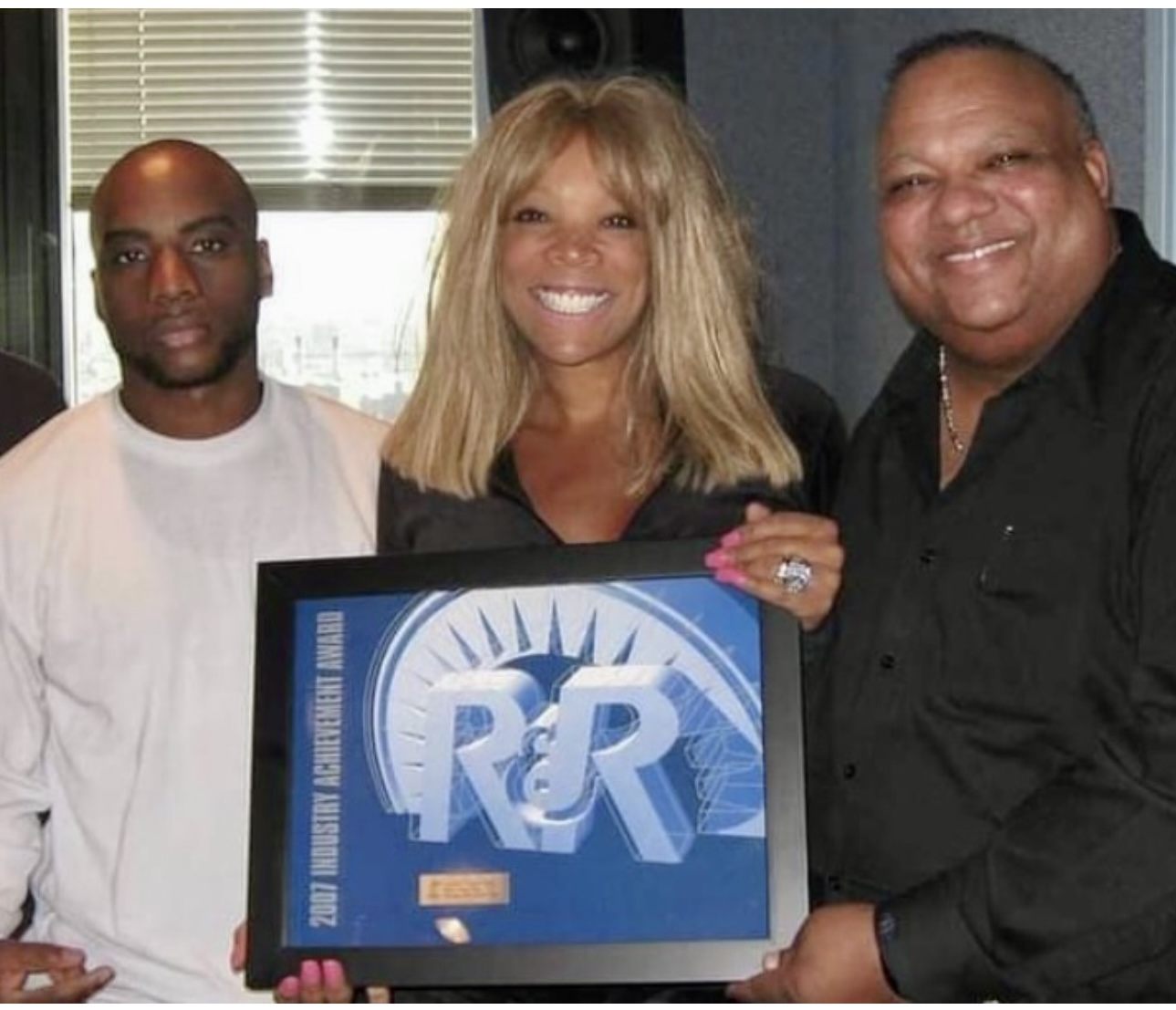 Wendy Williams receives special honors from R&R magazine. Left to Right: Charlamagne tha God, Wendy Williams and Vinny Brown. (Photo Courtesy of Vinney Brown Collection) 