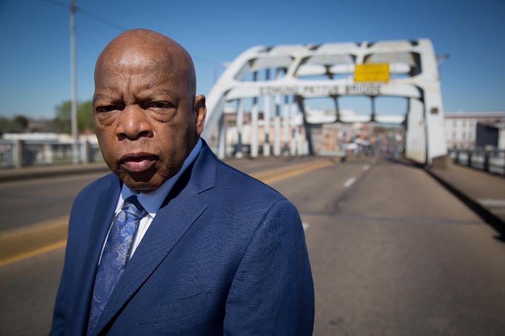 John Lewis statue replaces century-old Confederate monument. // John Lewis in front of Edmond Pettus Bridge in Selma Al (Jeremy Moorhead-CNN via CNN Newsource) 