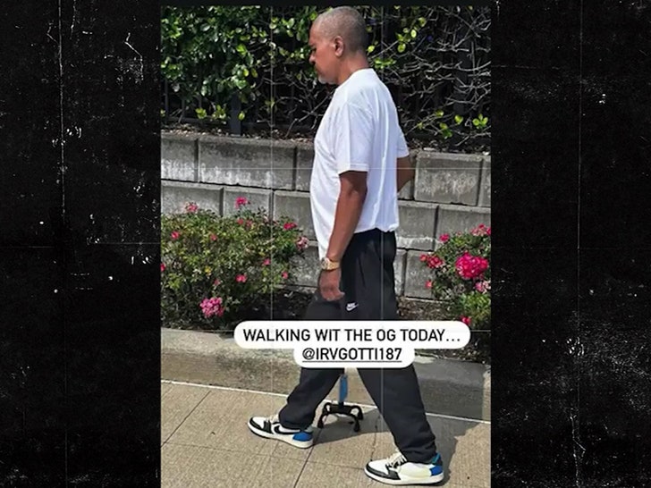 Irv Gotti walking with cane