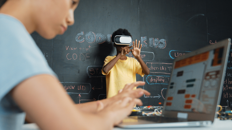 Closeup of school girl hand coding program while student using VR. Edification. HBCUs, university, Taste of Tomorrow