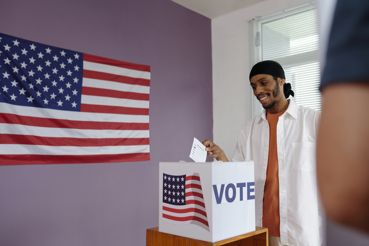 Man Throwing Bulletin In Box