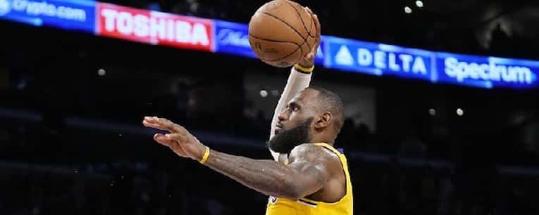 Netflix enlists LeBron James and Anthony Edwards for 'Starting 5.' // LeBron James airborne (Mark J Terrill-AP)