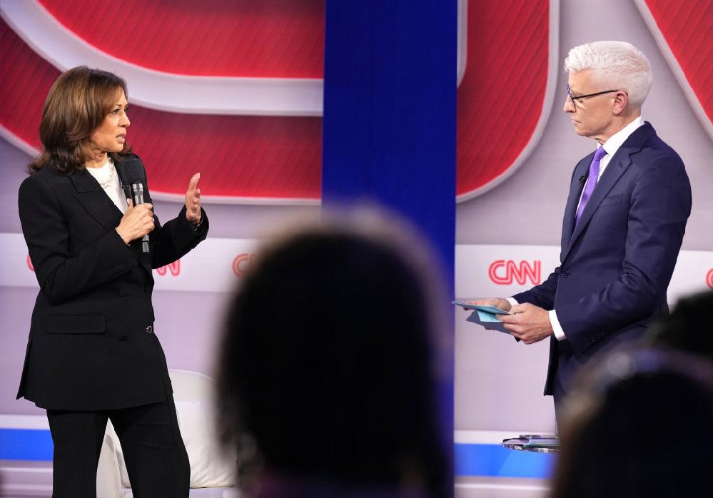 Anderson Cooper and Charlamagne Tha God clash on CNN Thursday // Kamala Harris and Anderson Cooper at CNN Town Hall - GettyImages