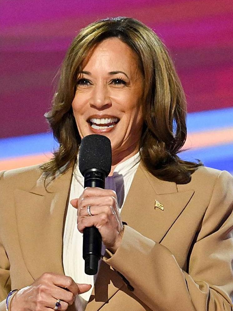 Netflix faced record cancellations post Harris donation // Kamala Harris (tan suit) - Getty