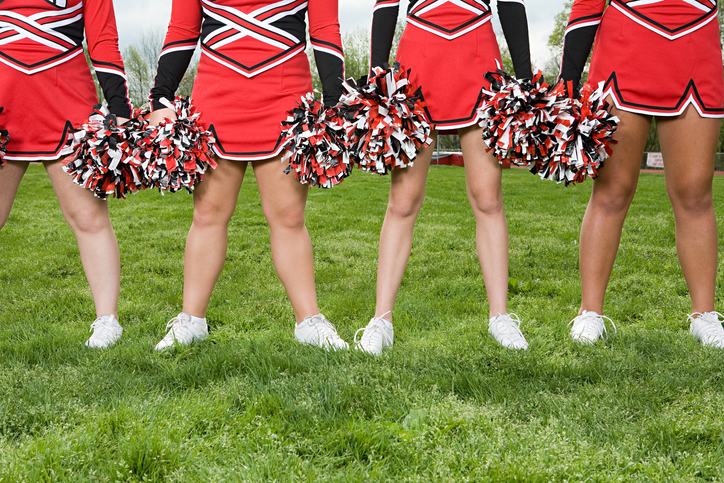 Cheerleaders with pom poms